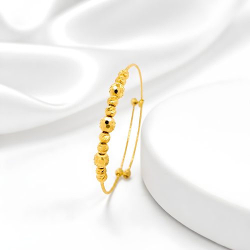 21K Bafleh Gold Expandable Baby Bangle featuring Alternating Textured Beads