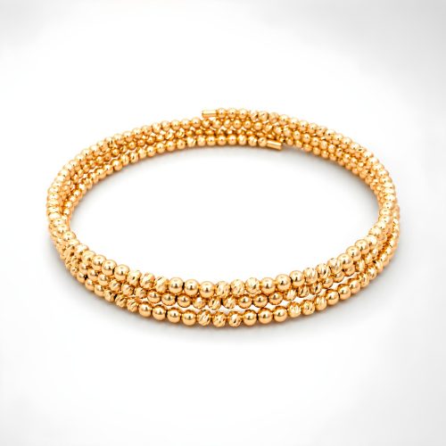Discover the Perfect Blend of Modern Style and Timeless Beauty with Our 18K Gold Spring Bangle with Beats Pattern