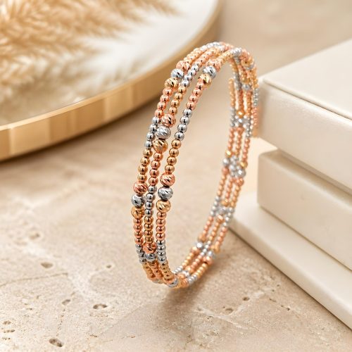 Celebrate Grace and Glamour with the Beautifully Crafted 18K Gold Spring Bangle Featuring Beats Motifs