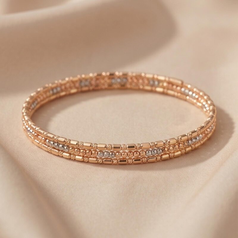 Make Every Moment Sparkle with the Elegant 18K Gold Spring Bangle with Beats Design Available at Bafleh Jewellery