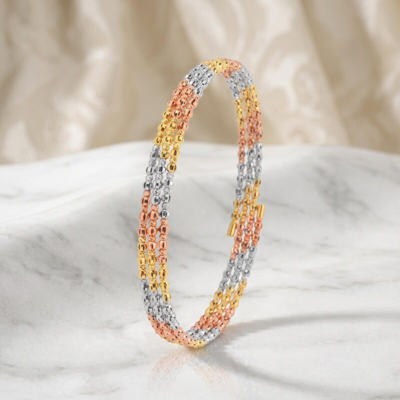 Elevate Your Elegance with the Stunning Spring Bangle Featuring Beats Design in 18K Gold Exclusively at Bafleh Jewellery
